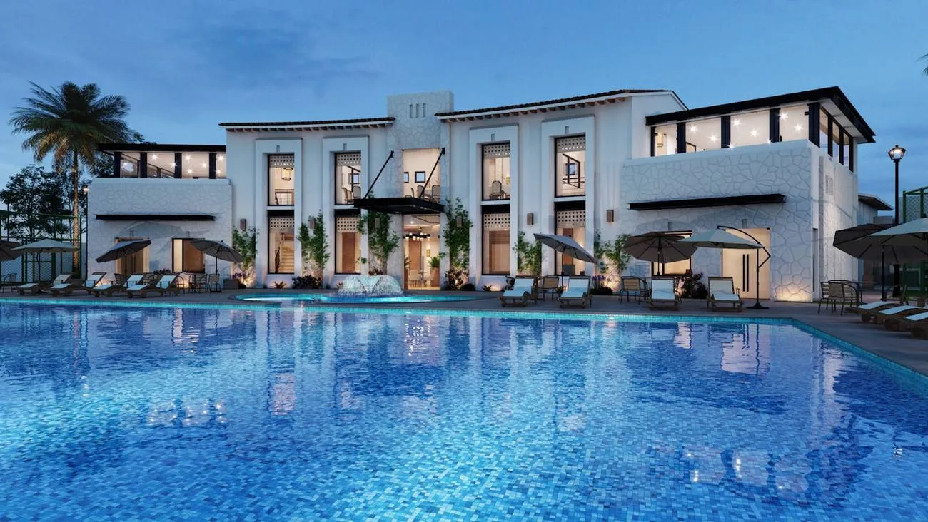 Villa contemporaine avec piscine à débordement au coucher du soleil
